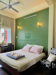 Un ou plusieurs lits dans un hébergement de l'établissement Paulatim House Saigon