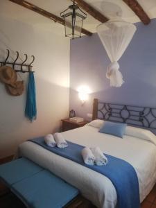 Postel nebo postele na pokoji v ubytování Casa de los nogales