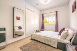 a bedroom with a bed and a large mirror at Villa Caballa in Roldán +17 photos