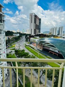 a view of a city from a balcony at Spc Arena Apartment Service in Bayan Lepas +4 photos