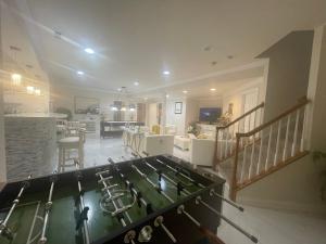 a kitchen and living room with a stove top oven at Pleasant, Enjoyable and Relaxing, Lower Level in Silver Spring