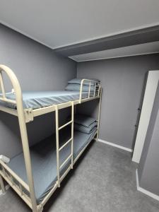 a bunk room with two bunk beds in it at Gangnam Seven Hostel in Seoul +18 photos