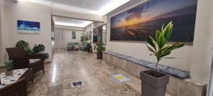 a living room with a potted plant on the wall at Luis Apartments in Mastihari