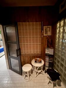 a small room with a table and a table and chairs at Riverside Villa Aurora in Rovaniemi