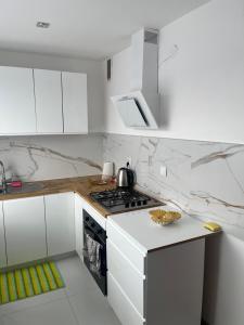 Kuchyň nebo kuchyňský kout v ubytování Apartament Centrum Okulickiego !
