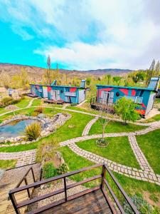 a row of colorful houses in a park at CASA FARO ARTE in Potrerillos