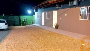 a car parked outside of a house at night at Casa de dois quartos in Carolina