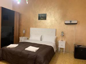Postel nebo postele na pokoji v ubytování PRINCIPE ROOMS