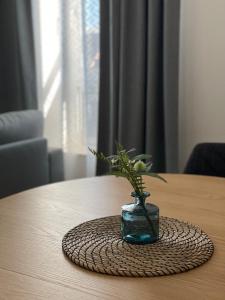a vase with a plant in it on a table at Moderne Wohnung - renoviert 2024 in Solingen +30 photos