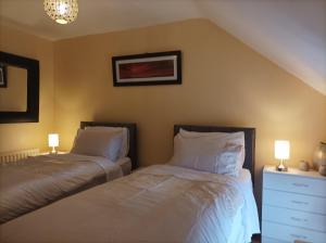 En eller flere senge i et værelse på Promenade Cottage, Newcastle, County Down