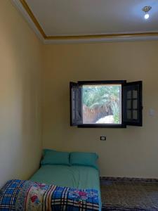 Postel nebo postele na pokoji v ubytování Oum House Siwa