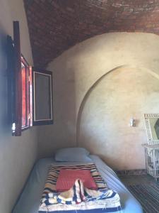 Postel nebo postele na pokoji v ubytování Oum House Siwa