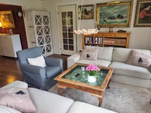 a living room with a couch and a coffee table at Haby House Old in Skene