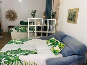a bedroom with a bed and a white book shelf at ruzafa oceanograf science center in Valencia +59 photos