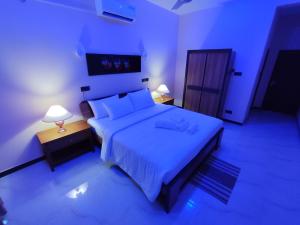 Postel nebo postele na pokoji v ubytování Villa Infinity Negombo