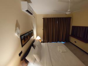 Postel nebo postele na pokoji v ubytování Villa Infinity Negombo