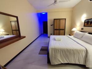 Postel nebo postele na pokoji v ubytování Villa Infinity Negombo