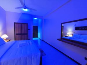 Postel nebo postele na pokoji v ubytování Villa Infinity Negombo