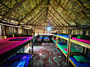 a group of bunk beds in a room at Hotel Rancho Tranquilo Beach in Jiquilillo