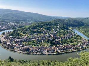 an aerial view of a small town on a river at Le carolo in Tournes