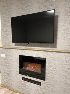 TV a/nebo společenská místnost v ubytování High Quality Lovely Apartment + 20 fotografií