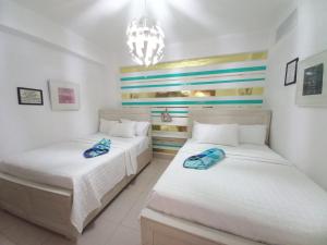 Postel nebo postele na pokoji v ubytování Las Olas, Juan Dolio 2bed2bath Condo