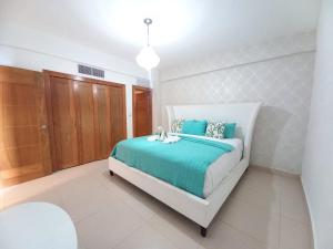 Postel nebo postele na pokoji v ubytování Las Olas, Juan Dolio 2bed2bath Condo + 6 fotografií