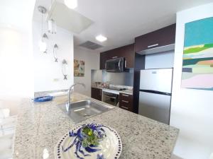 Kuchyň nebo kuchyňský kout v ubytování Las Olas, Juan Dolio 2bed2bath Condo
