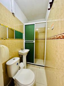 a bathroom with a toilet and a sink and a shower at Hostal La Española de Getsemani in Cartagena de Indias +83 photos