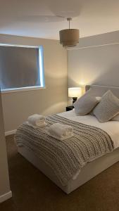 Ένα ή περισσότερα κρεβάτια σε δωμάτιο στο Riverview Executive Apartment