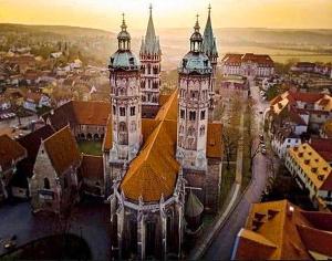 an aerial view of a large building with two towers at Appartement Doesjes Huis in Naumburg