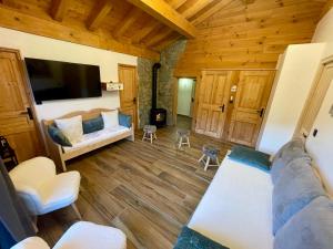 Un televizor și/sau centru de divertisment la Le Tout Schuss Chalet, SPA Privé, piste de ski à 100m
