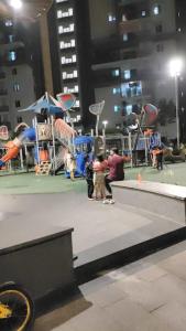 a group of people standing in a playground at Skyline View Suite in Hyderabad