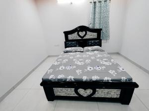 a bed sitting in a room with at Skyline View Suite in Hyderabad
