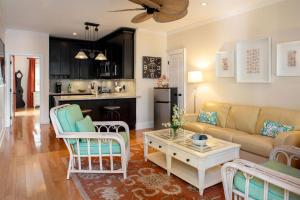 a living room with a couch and a table at The Gardens Hotel in Key West