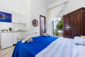 Postel nebo postele na pokoji v ubytování Il balcone sullo Stretto