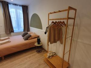 Postel nebo postele na pokoji v ubytování Appartement Ô Arcades