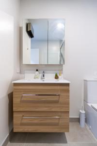 a kitchen with a sink and a toilet at The Kind Kiwi A brand new home in Riccarton in Christchurch