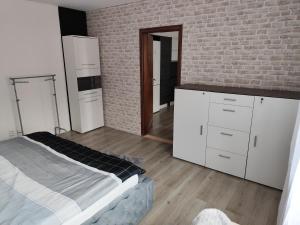 Postel nebo postele na pokoji v ubytování Apartmán pod věží