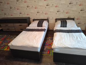Postel nebo postele na pokoji v ubytování Apartmán pod věží