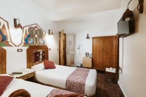Postel nebo postele na pokoji v ubytování Nefertiti Hotel Luxor