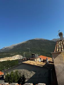 a view from the roof of a building with a mountain in the background at Al Centro Storico in Campoli Appennino