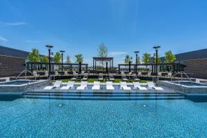 a swimming pool with lounge chairs and a swimming pool at Superb NEW 2BR amazing amenities in Salt Lake City