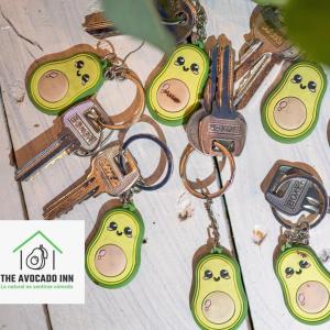 a group of key chains with faces on them at Aguacate in San Pedro Sula
