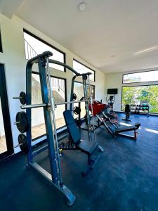 a gym with two treadmills and two tread machines at Naia Tulum Apartment in Tulum