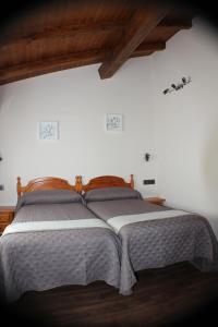 מיטה או מיטות בחדר ב-Hostal Extremeño
