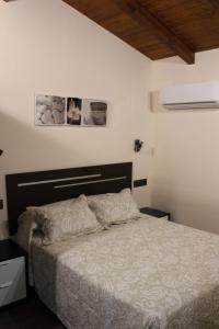 Postel nebo postele na pokoji v ubytování Hostal Extremeño