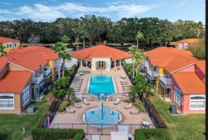 an aerial view of a resort with a swimming pool at Resort Community 4 Bedroom Family Home, Pool & 15 Min Disney in Kissimmee