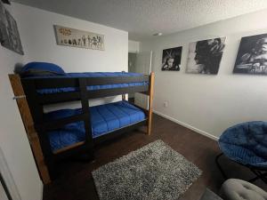 a bedroom with two bunk beds in a room at Resort Community 4 Bedroom Family Home, Pool & 15 Min Disney in Kissimmee +44 photos