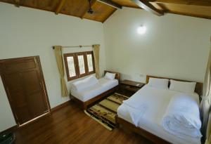 Postel nebo postele na pokoji v ubytování Bardia Eco Friendly Homestay